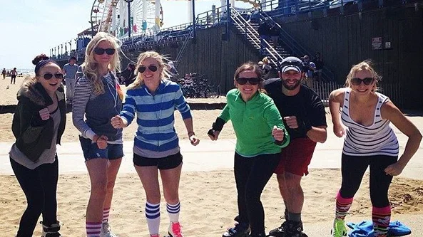 Six medical students rollerblading at the Santa Monica Pier.