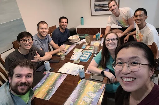 Residents (and their partners) getting together for a board game night (Class of 2025-2027)