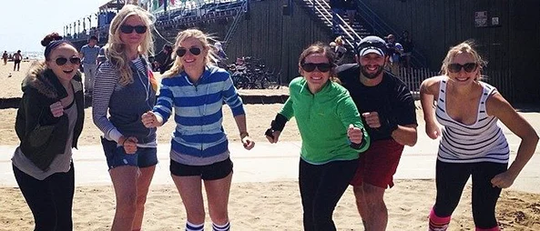 Six medical students rollerblading at the Santa Monica Pier.
